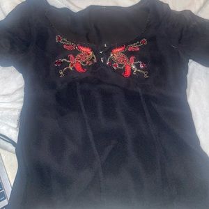 Black mesh blouse with beading.